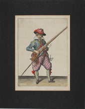 Load image into Gallery viewer, Jacques de Gheyn II. Musketeer raising both musket and fork in his left hand. Colored engraving. 1607.
